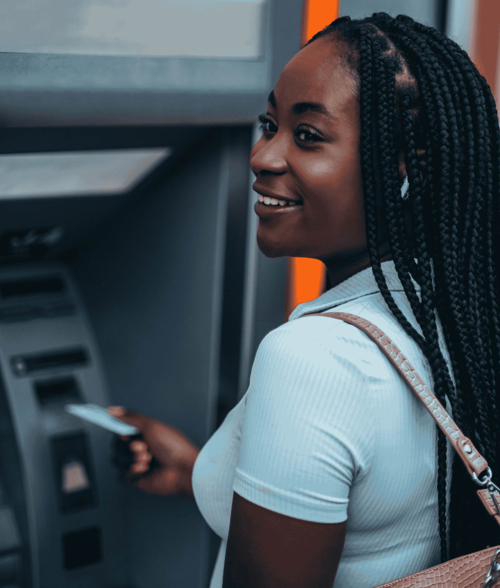 Young person at an ATM to withdraw wages